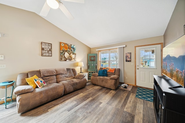 living area with baseboards, a ceiling fan, lofted ceiling, and wood finished floors