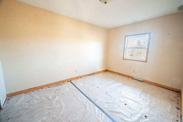 empty room with baseboards