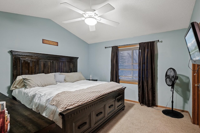 bedroom featuring baseboards, lofted ceiling, light carpet, and ceiling fan