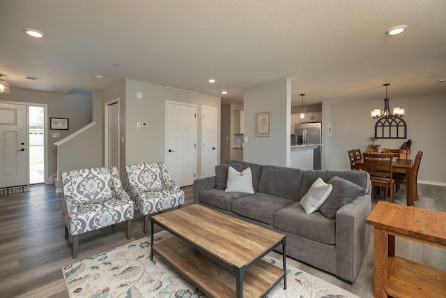 living area with recessed lighting and wood finished floors