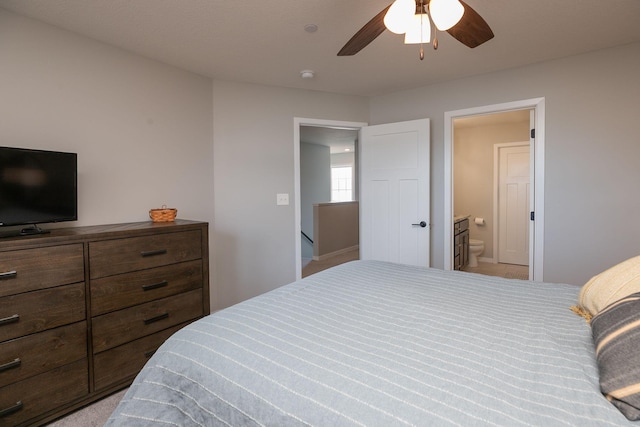 bedroom featuring ensuite bathroom and ceiling fan