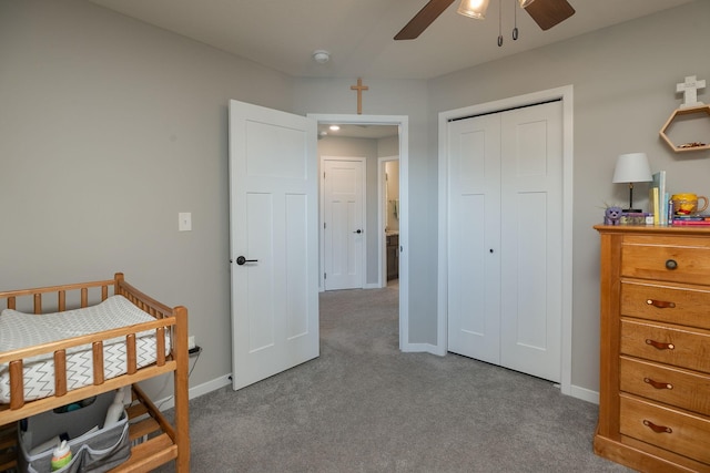 bedroom with carpet flooring, baseboards, a closet, and ceiling fan