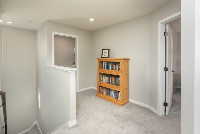 hall with carpet flooring, recessed lighting, and baseboards