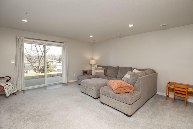 living area with recessed lighting, baseboards, and carpet floors