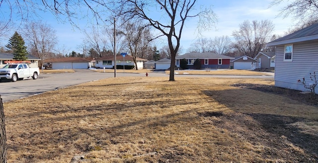 view of yard featuring a residential view