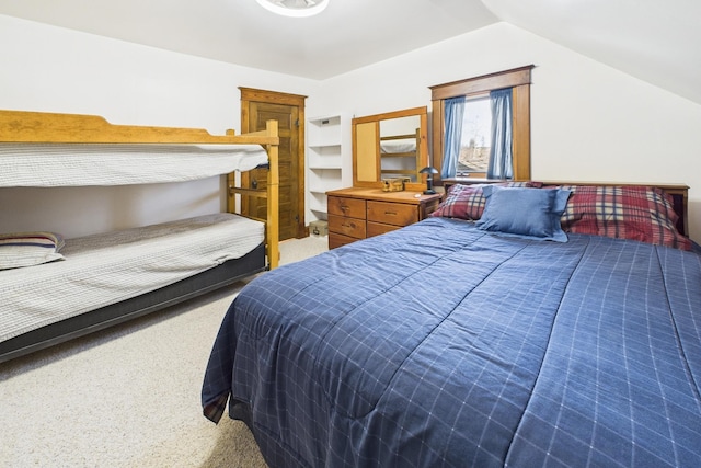 bedroom featuring vaulted ceiling