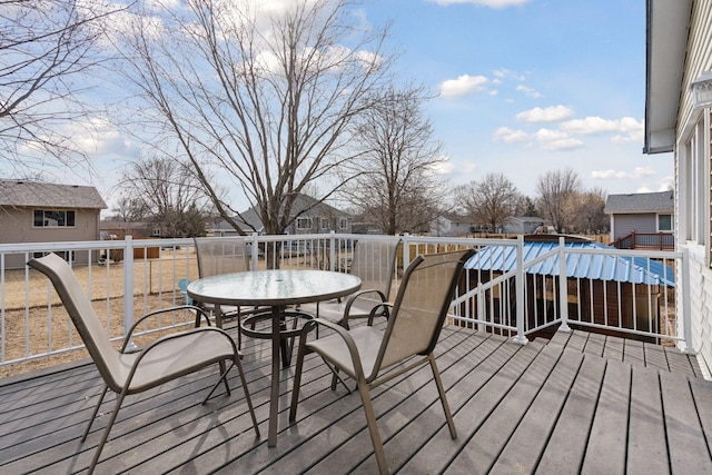 wooden terrace featuring outdoor dining space