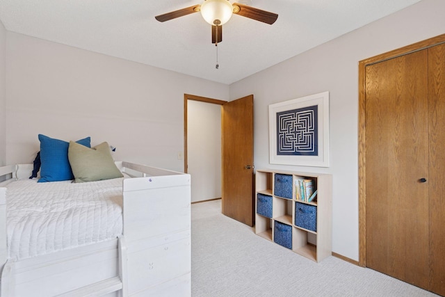 bedroom with baseboards, carpet floors, and ceiling fan