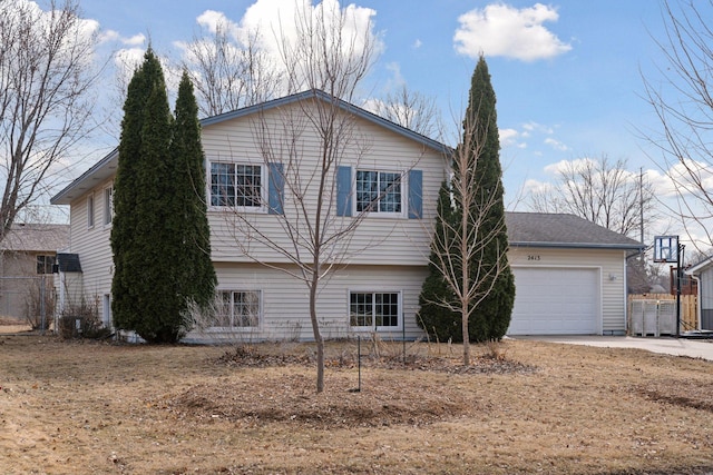 view of front of house featuring concrete driveway and an attached garage