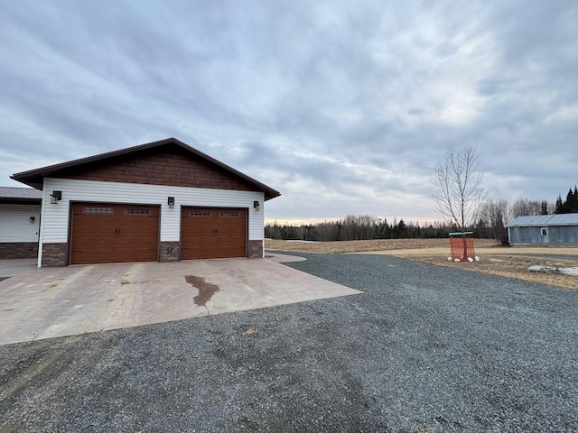 garage with concrete driveway