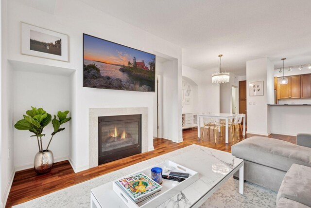 500 Grant St Unit 807, Minneapolis, MN 55404 - living area with a glass covered fireplace, wood finished floors, and baseboards