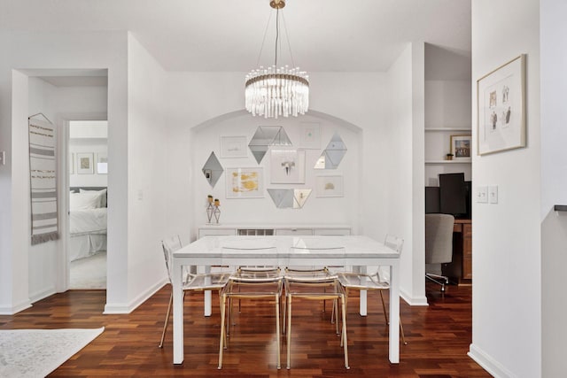 500 Grant St Unit 807, Minneapolis, MN 55404 - dining room with a notable chandelier, baseboards, and dark wood-style flooring