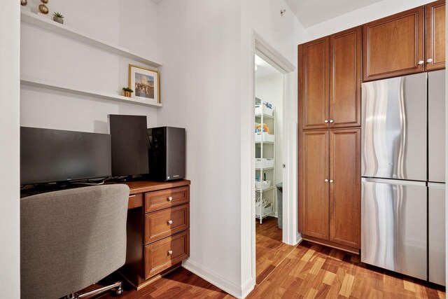 500 Grant St Unit 807, Minneapolis, MN 55404 - office with light wood finished floors, built in study area, and baseboards
