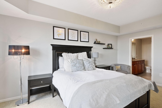 500 Grant St Unit 807, Minneapolis, MN 55404 - carpeted bedroom with ensuite bath and baseboards