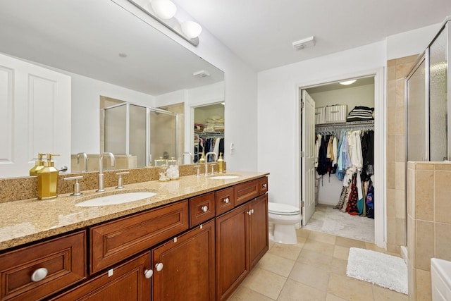 500 Grant St Unit 807, Minneapolis, MN 55404 - full bath with double vanity, a spacious closet, a stall shower, and a sink