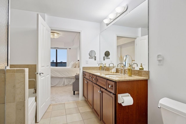 500 Grant St Unit 807, Minneapolis, MN 55404 - ensuite bathroom with ensuite bath, double vanity, a sink, tile patterned flooring, and toilet