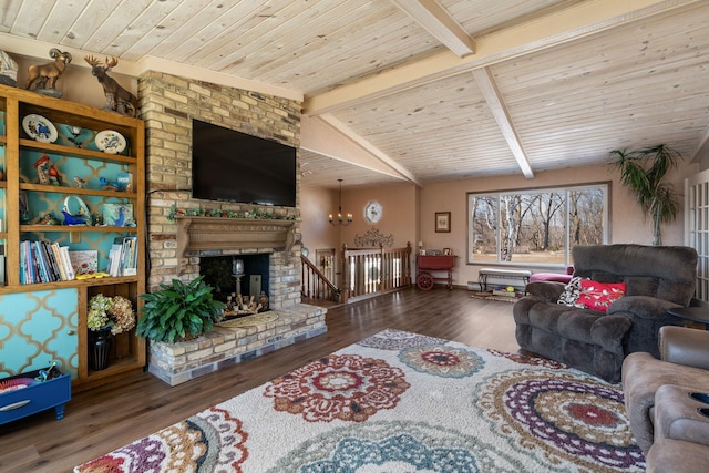 living area with wooden ceiling, a brick fireplace, wood finished floors, and vaulted ceiling with beams