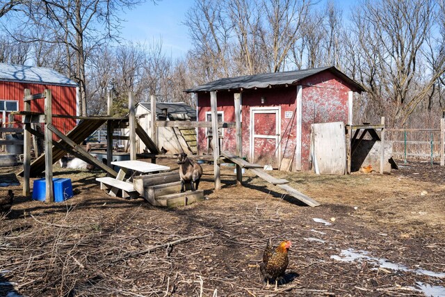 view of shed with fence