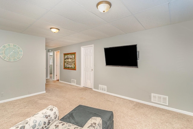 interior space featuring carpet, visible vents, and a paneled ceiling