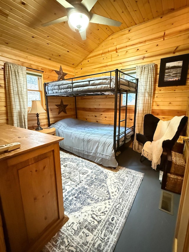 2897 Indian Mound Rd, Luck, WI 54853 - bedroom featuring wooden ceiling, wood walls, and lofted ceiling