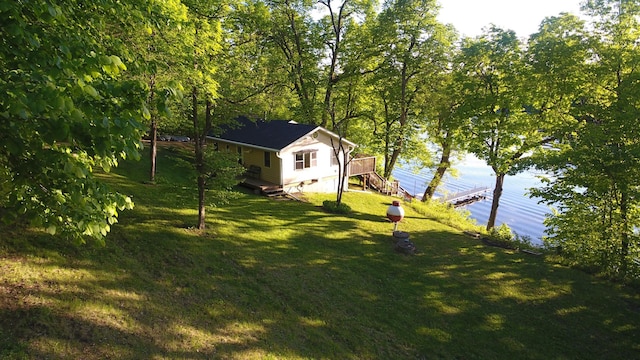 2897 Indian Mound Rd, Luck, WI 54853 - view of green lawn featuring a wooden deck and stairway