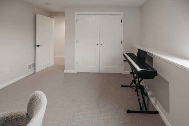 interior space with visible vents, baseboards, and carpet