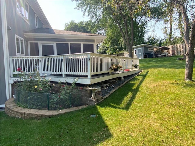 view of yard featuring a wooden deck and a sunroom