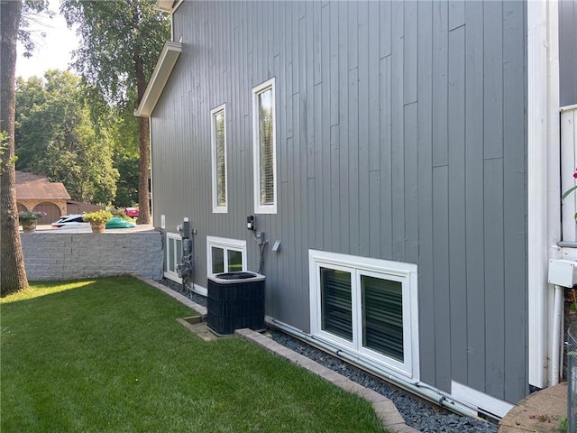 view of property exterior featuring a yard and cooling unit