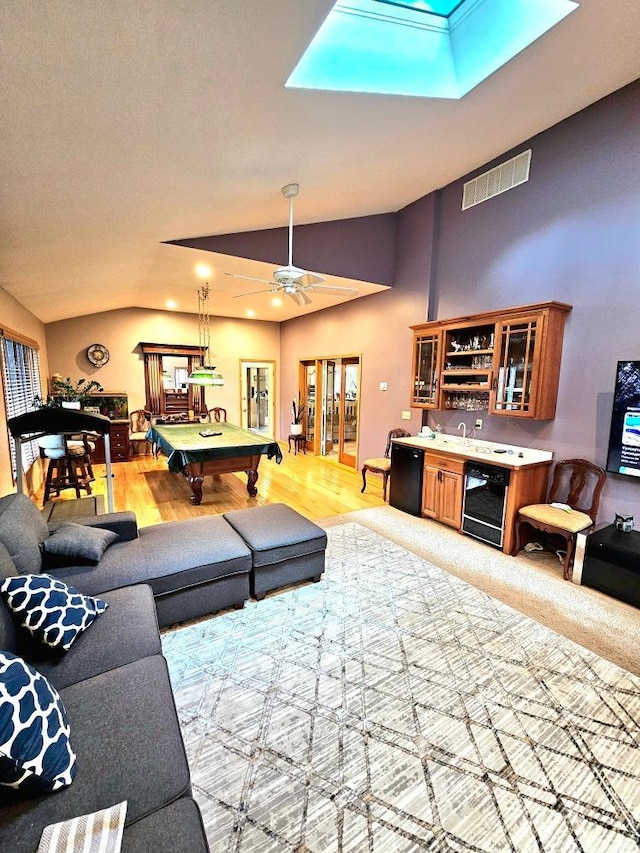 living room with indoor wet bar, wine cooler, billiards, and vaulted ceiling