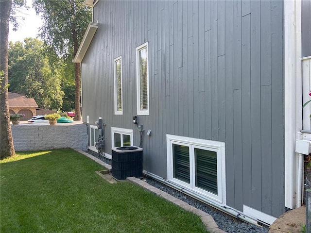 904 155th St, Burnsville, MN 55306 - view of home's exterior featuring cooling unit and a yard