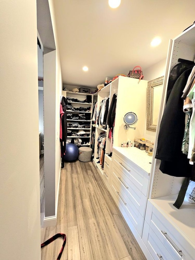 904 155th St, Burnsville, MN 55306 - walk in closet featuring light wood-style flooring