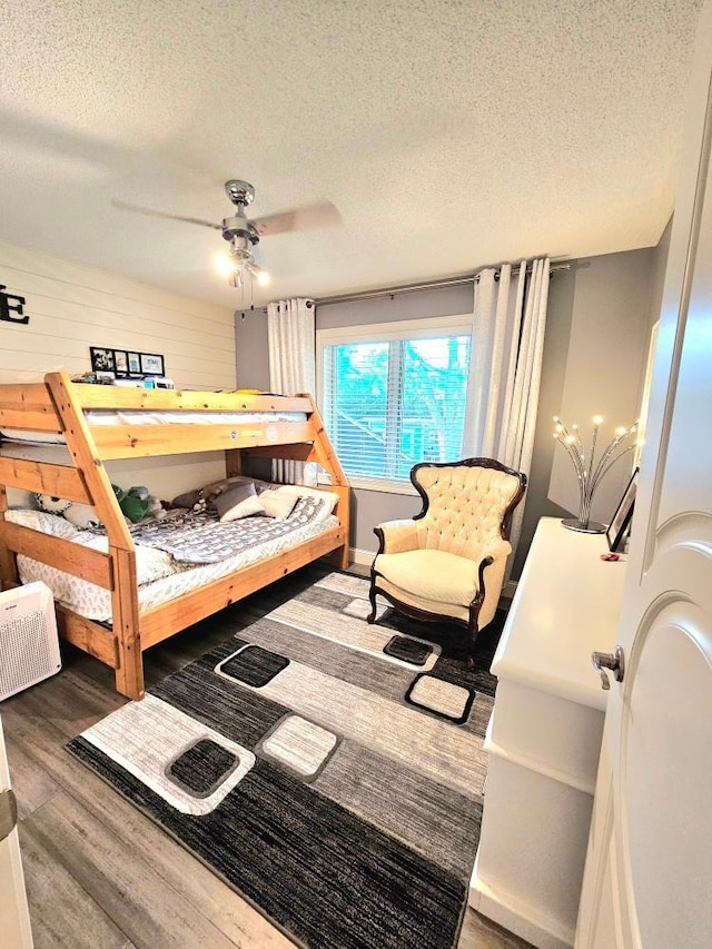 904 155th St, Burnsville, MN 55306 - bedroom featuring a textured ceiling and wood finished floors