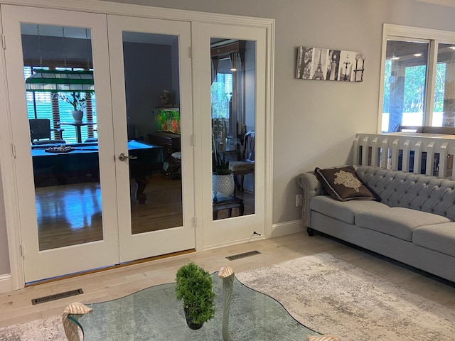 904 155th St, Burnsville, MN 55306 - living room with wood finished floors, baseboards, and french doors