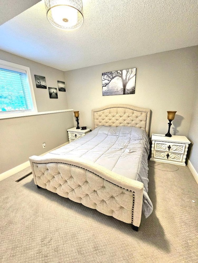 904 155th St, Burnsville, MN 55306 - carpeted bedroom with baseboards and a textured ceiling