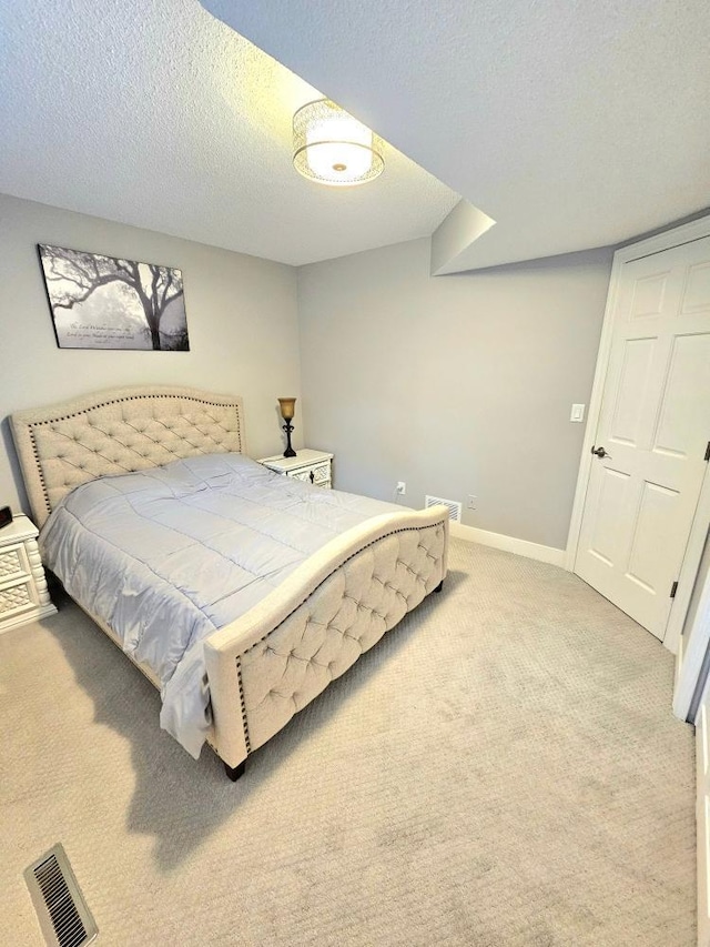 904 155th St, Burnsville, MN 55306 - bedroom with carpet floors, a textured ceiling, and baseboards