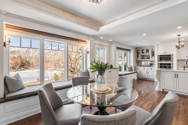 dining area with crown molding, recessed lighting, dark wood-style floors, and a chandelier