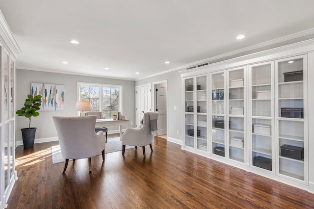 sitting room featuring baseboards, dark wood-style floors, and crown molding