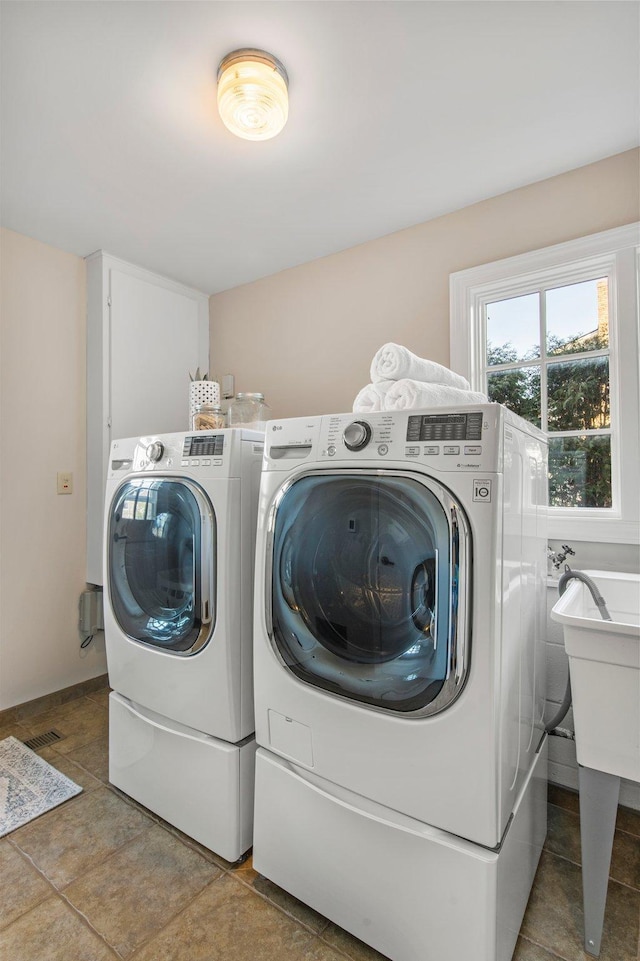 washroom with washer and dryer and laundry area