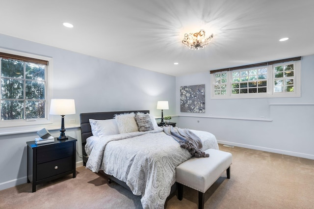 bedroom with recessed lighting, baseboards, and light carpet