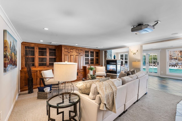 living area featuring light tile patterned flooring, recessed lighting, a multi sided fireplace, and baseboards