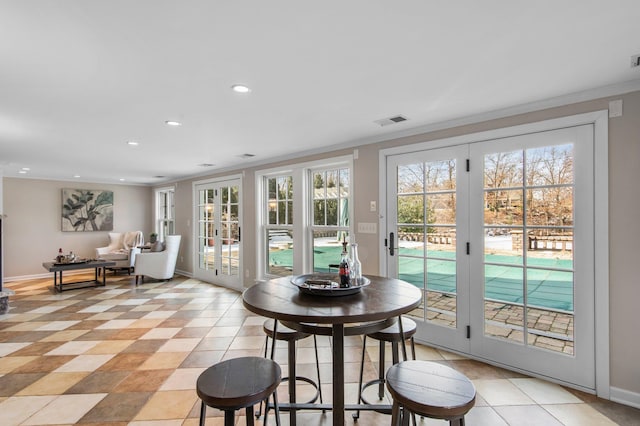 dining area with recessed lighting, visible vents, baseboards, and a healthy amount of sunlight