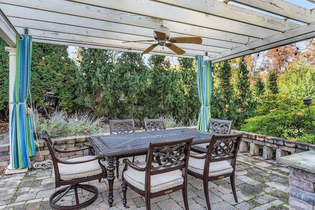 view of patio / terrace featuring outdoor dining space, a pergola, and ceiling fan