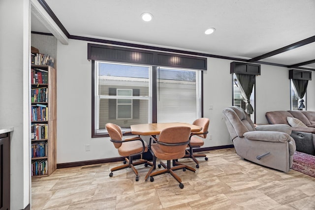 dining space featuring recessed lighting, baseboards, and crown molding