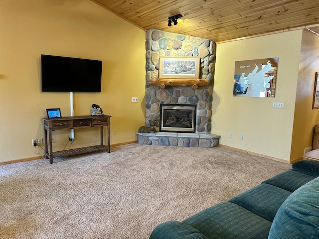 carpeted living room featuring baseboards, lofted ceiling, wood ceiling, and a fireplace