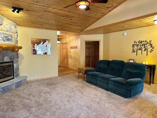 carpeted living room featuring baseboards, ceiling fan, wood ceiling, lofted ceiling, and a fireplace