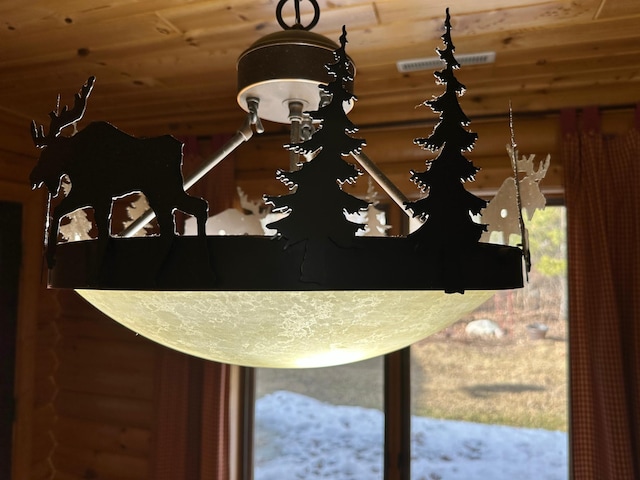 room details featuring wood ceiling and visible vents