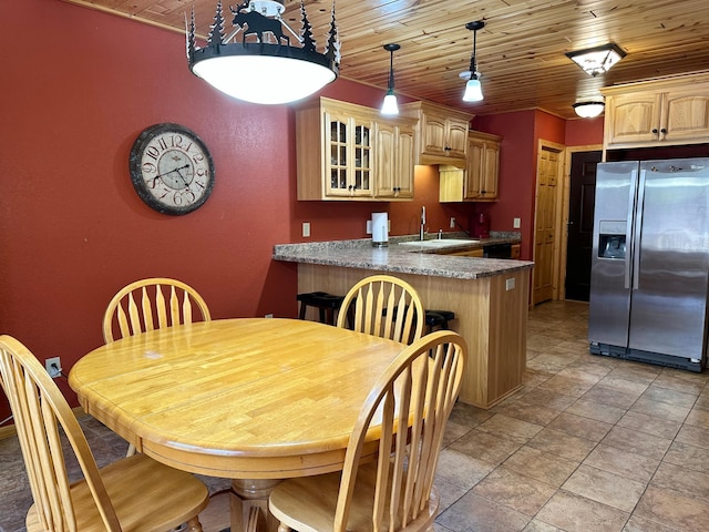 dining room with wood ceiling