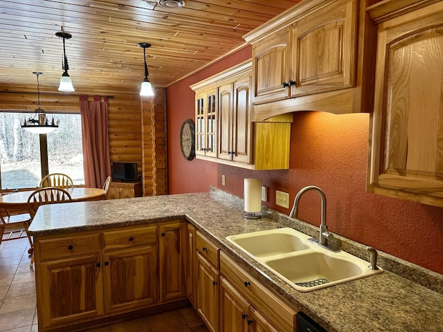 kitchen featuring log walls, a peninsula, a sink, wood ceiling, and pendant lighting