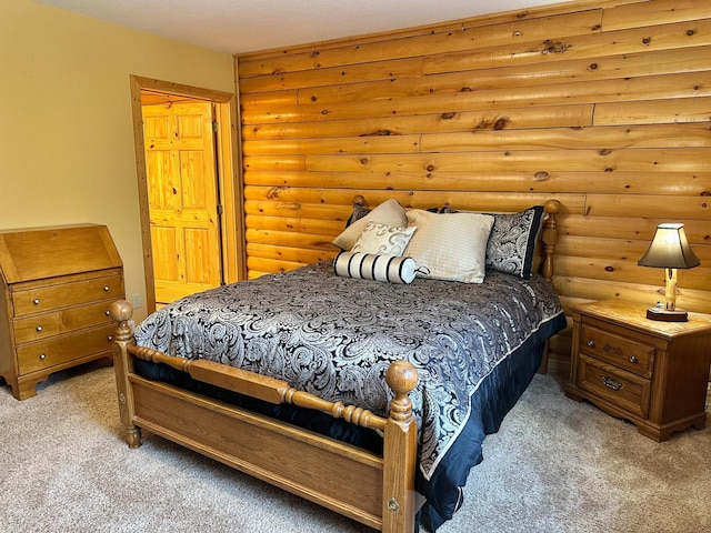 bedroom featuring light carpet and log walls