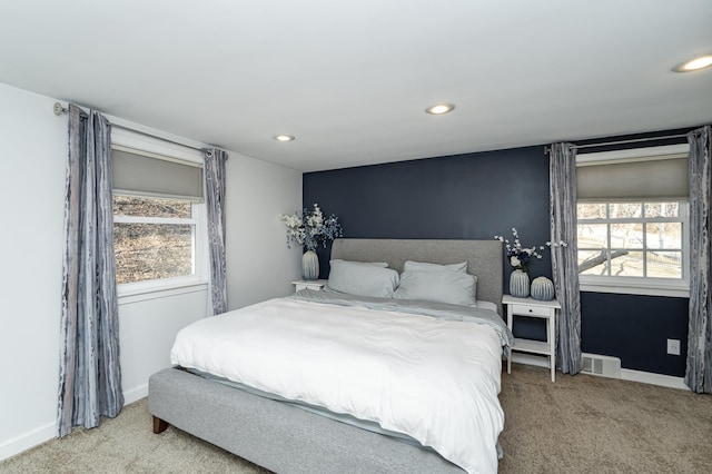 carpeted bedroom with visible vents, recessed lighting, and baseboards